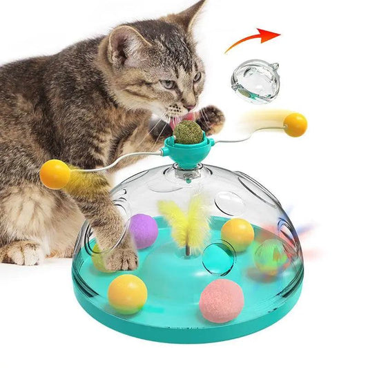 Cat playing with Whisker Wonderland interactive toy with colorful balls and teaser sticks