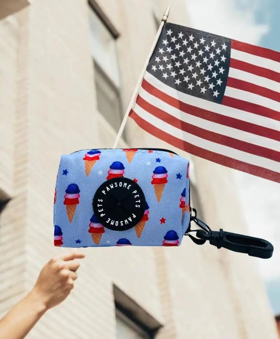 Blue neoprene waste bag holder with USA ice cream design and black clasp clip