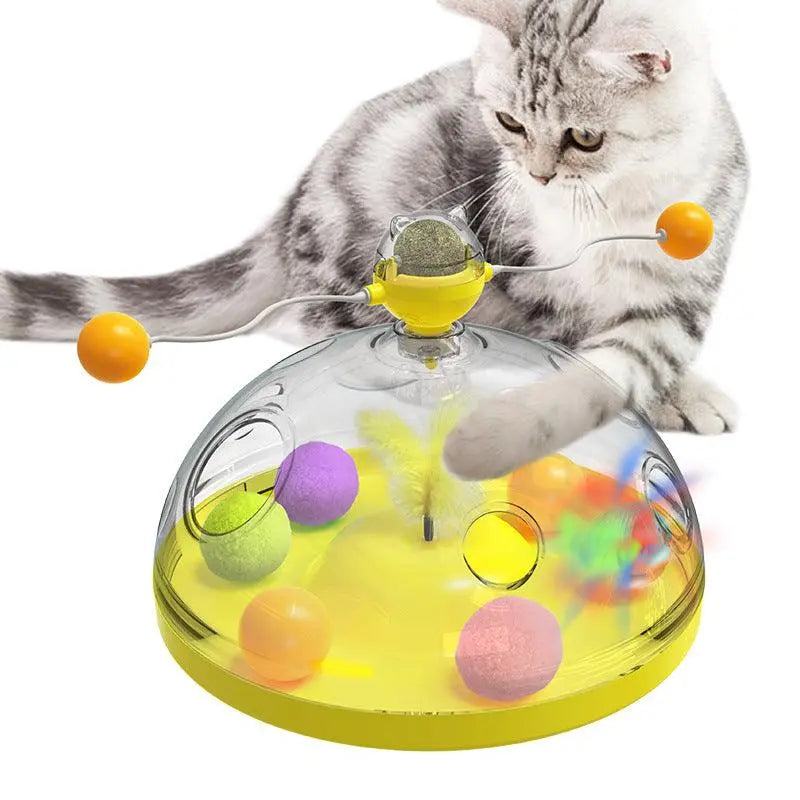 cat playing with Whisker Wonderland interactive yellow cat toy with balls and teaser sticks