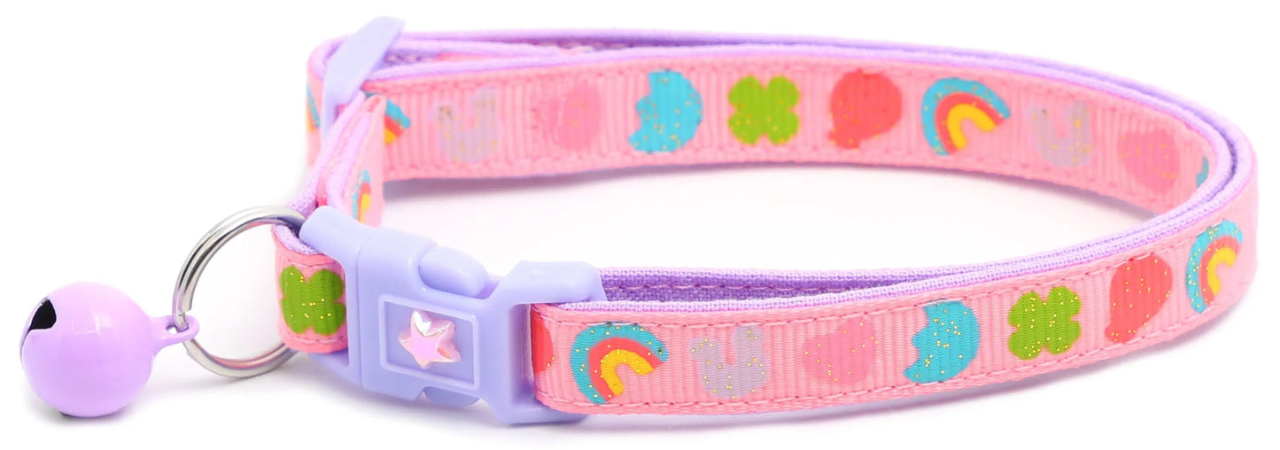Cereal Marshmallows Breakaway Collar pink cat collar with rainbow, moon, heart, and clover prints, breakaway clasp, and purple bell