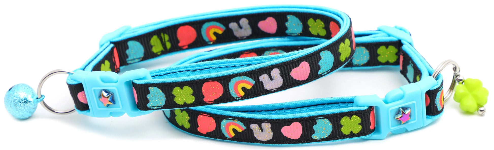 Cereal Marshmallows Breakaway Cat Collar with blue buckle, colorful heart and clover pattern, and removable bell charm
