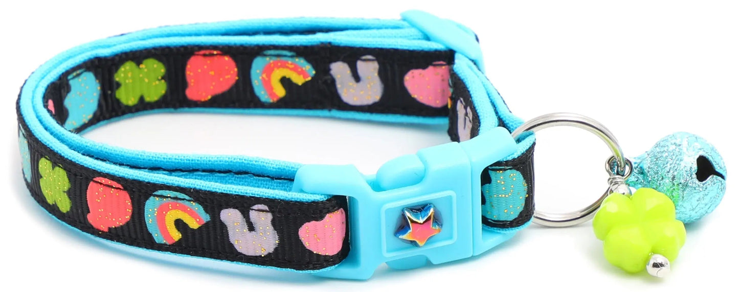 Cereal Marshmallows Breakaway Collar for cats with blue reinforced cotton, colorful cereal pattern, breakaway clip, and removable bell charm
