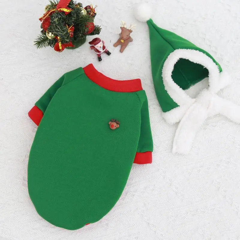 Green Cozy Canine Christmas Sweater with red collar and cuffs, festive pet apparel with matching elf hat and holiday decorations on white background
